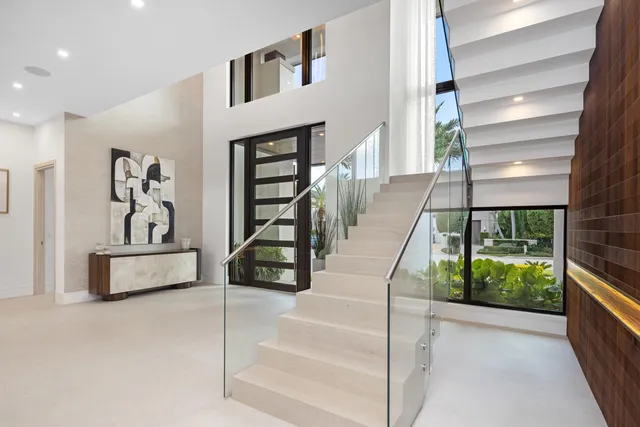 a kitchen with a stove and a white wooden cabinets