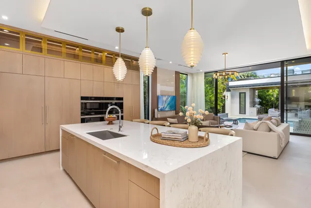 a bathroom with double vanity and a shower