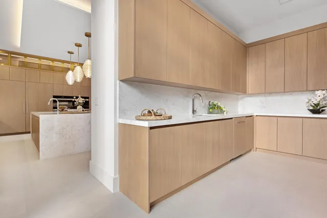 a bathroom with a toilet a sink a mirror and bathtub