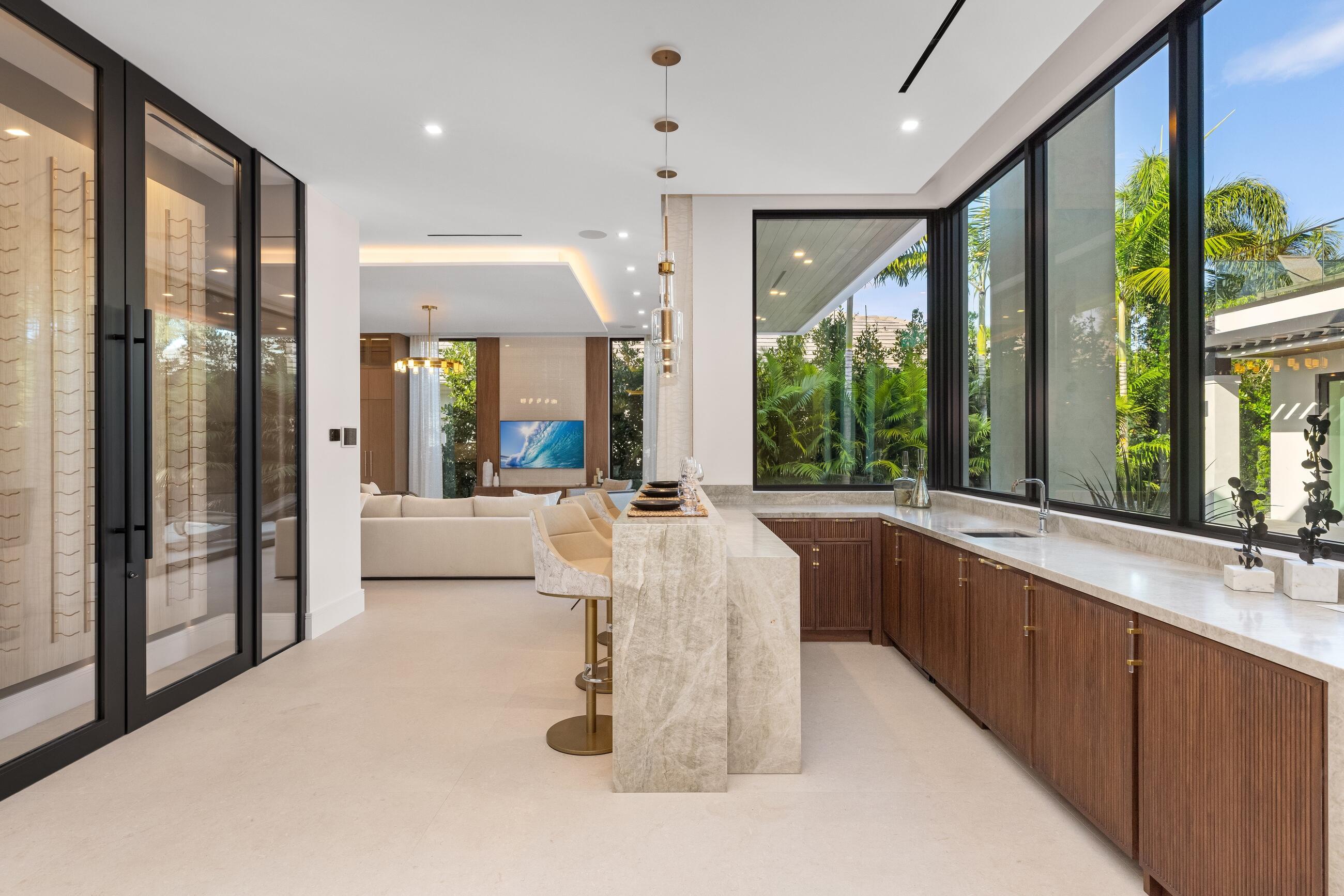 2498 Queen Palm Road Boca Raton, FL 33432 - Photo 35 of 80 a large white kitchen with a large window and sink