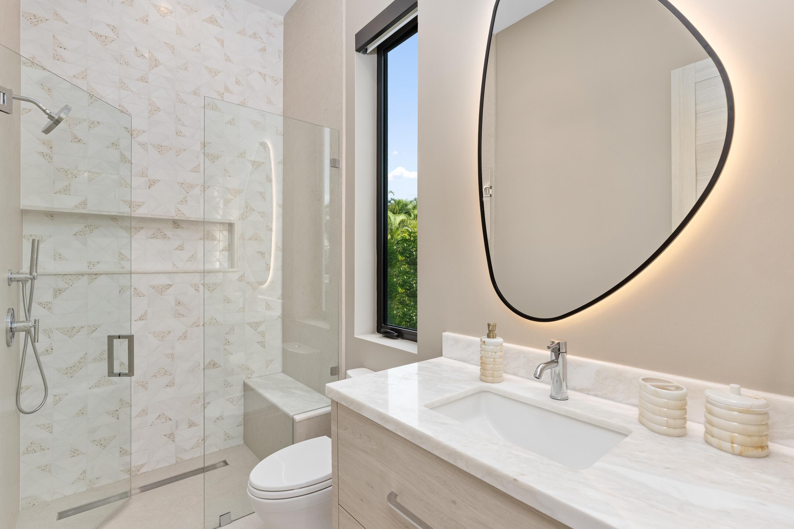 2498 Queen Palm Road Boca Raton, FL 33432 - Photo 45 of 80 a bathroom with a sink a toilet and a mirror