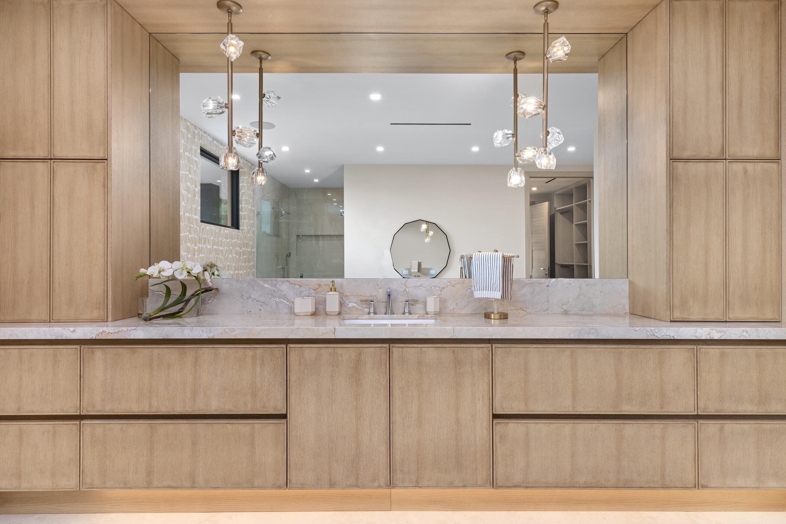 2498 Queen Palm Road Boca Raton, FL 33432 - Photo 57 of 80 a bathroom with a sink a mirror and vanity