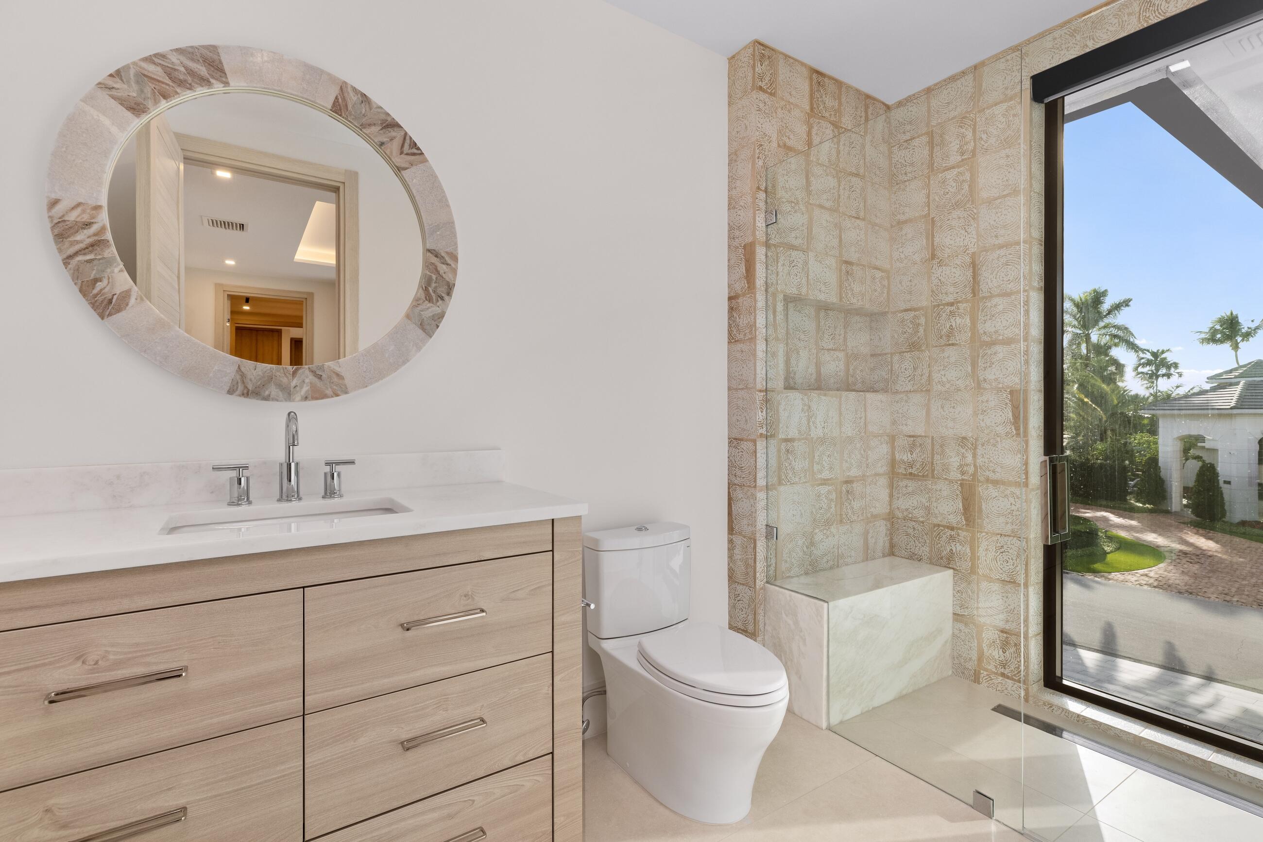 2498 Queen Palm Road Boca Raton, FL 33432 - Photo 64 of 80 a bathroom with a toilet a sink a mirror and bathtub