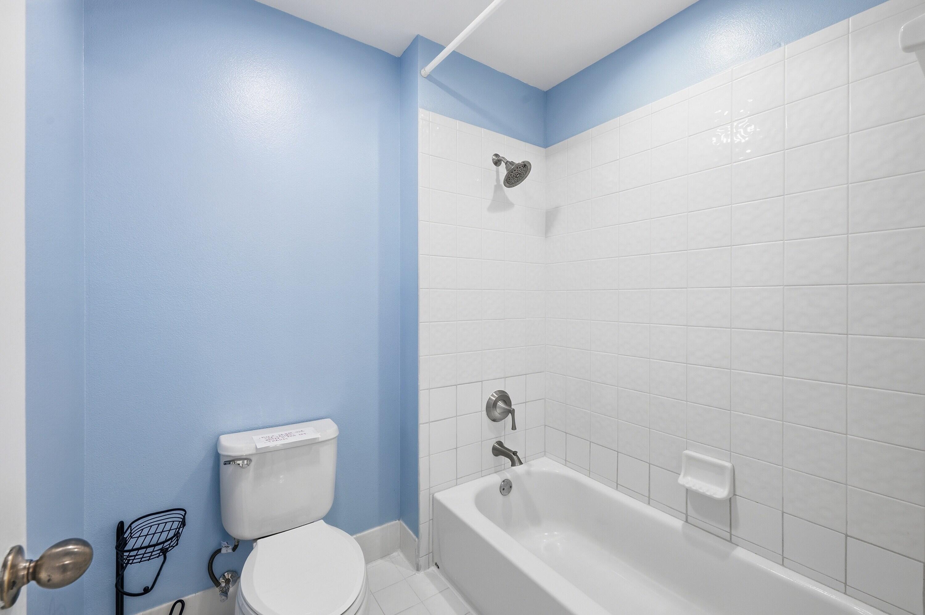 18474 Old Princeton Lane Boca Raton, FL 33498 - Photo 35 of 46 a white toilet sitting next to a bath tub