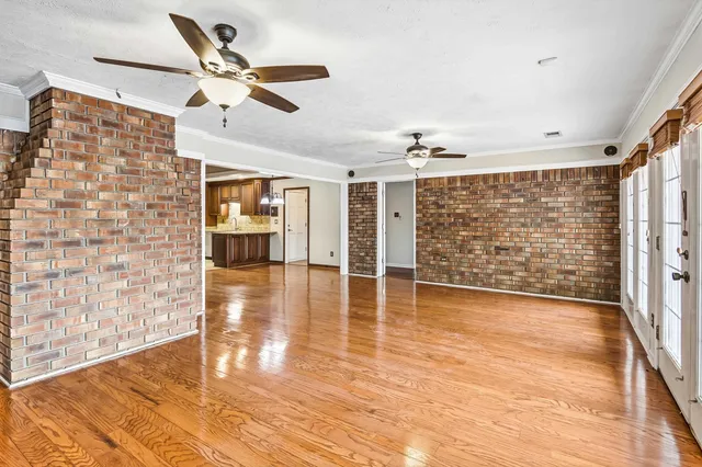 a view of a livingroom with wooden floor