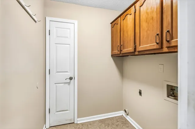 a view of front door with washer and dryer