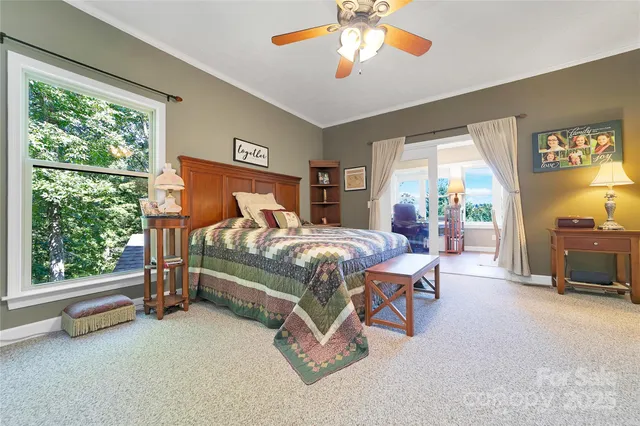 a bed room with a bed and a chandelier