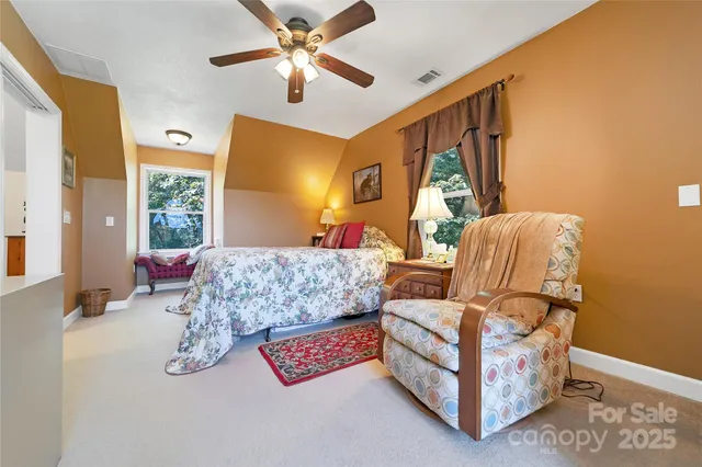 a balcony with table and chairs
