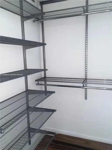 a view of an empty walk in closet