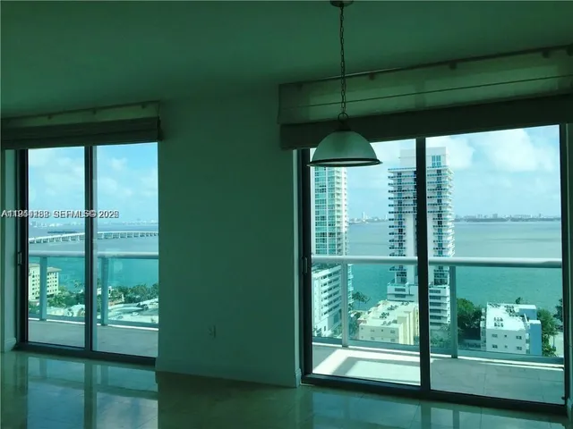 an aerial view of a residential building with an outdoor space