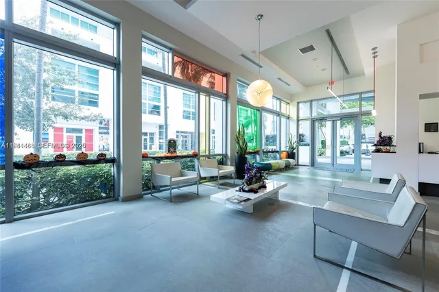 a kitchen with lots of counter top space and painting on the wall