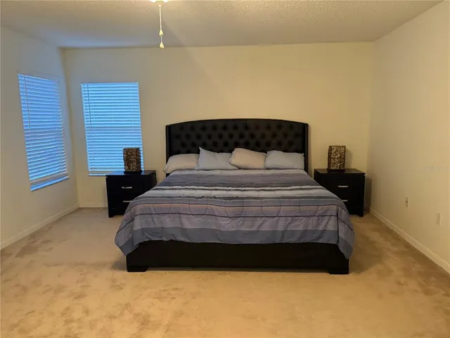 a bedroom with a bed and dresser