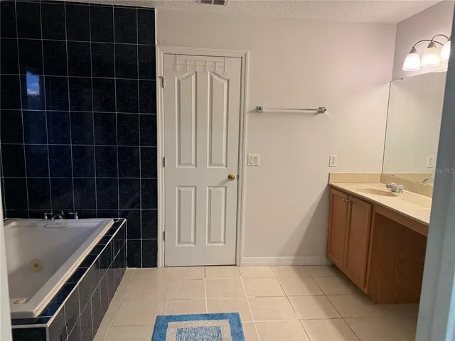 a bathroom with a bathtub and a sink