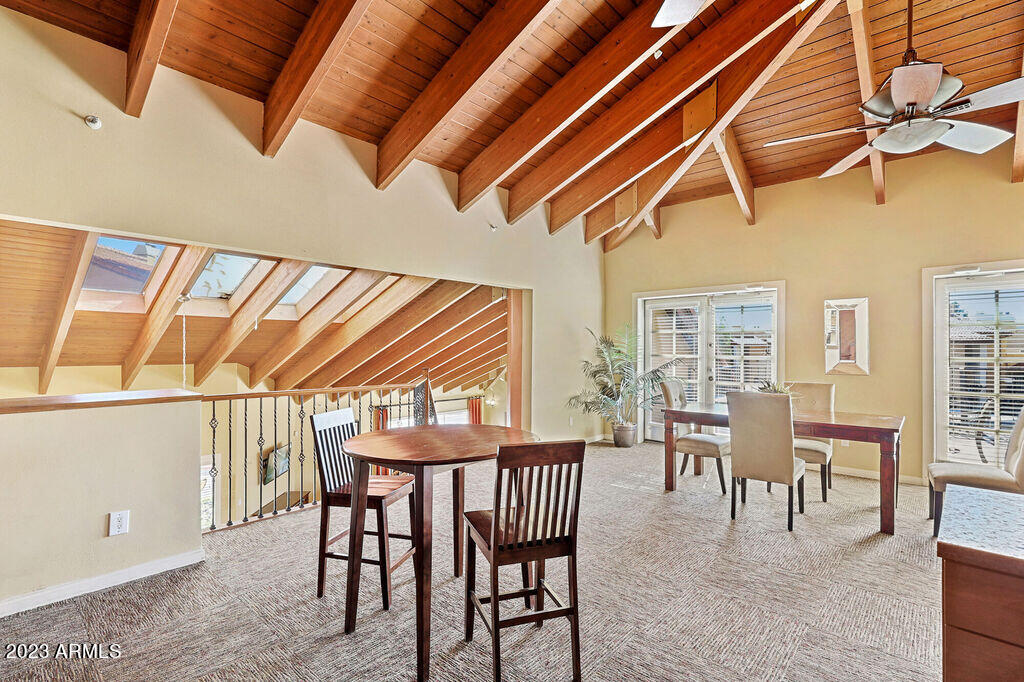 10002 North 7th Street, Unit C1 Phoenix, AZ 85020 - Photo 13 of 14 a dining room with furniture and wooden floor