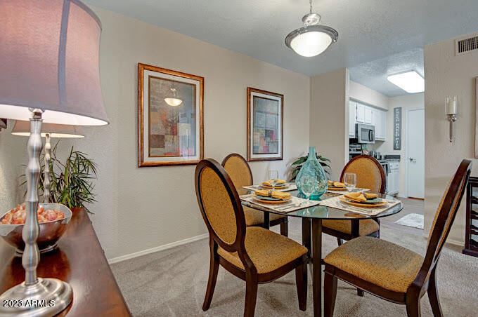10002 North 7th Street, Unit C1 Phoenix, AZ 85020 - Photo 5 of 14 a dining room with furniture and wooden floor