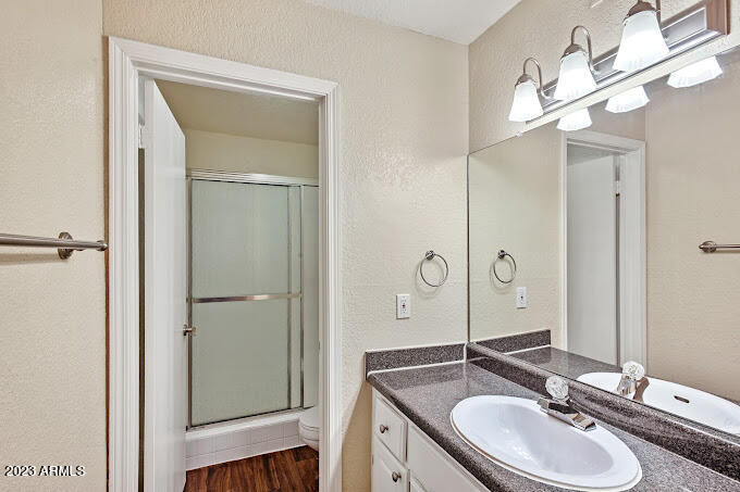 10002 North 7th Street, Unit C1 Phoenix, AZ 85020 - Photo 8 of 14 a bathroom with a sink double vanity and a mirror