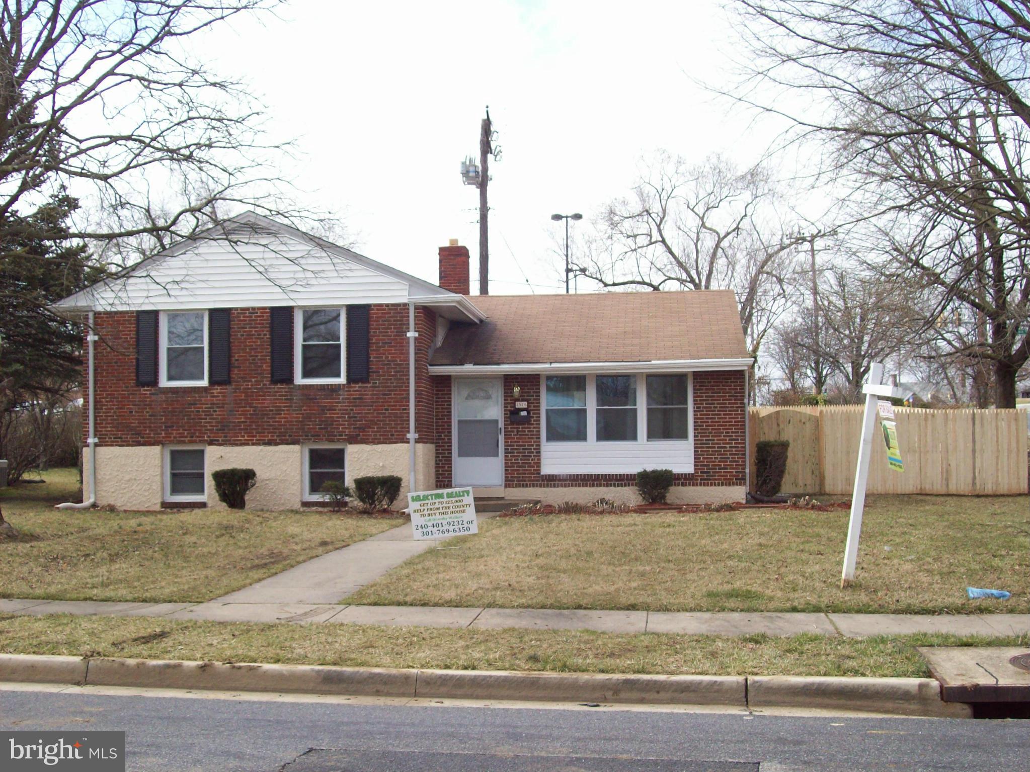 3516 Mayfair Road Baltimore, MD 21207 - Photo 1 of 10 a front view of a house with a yard