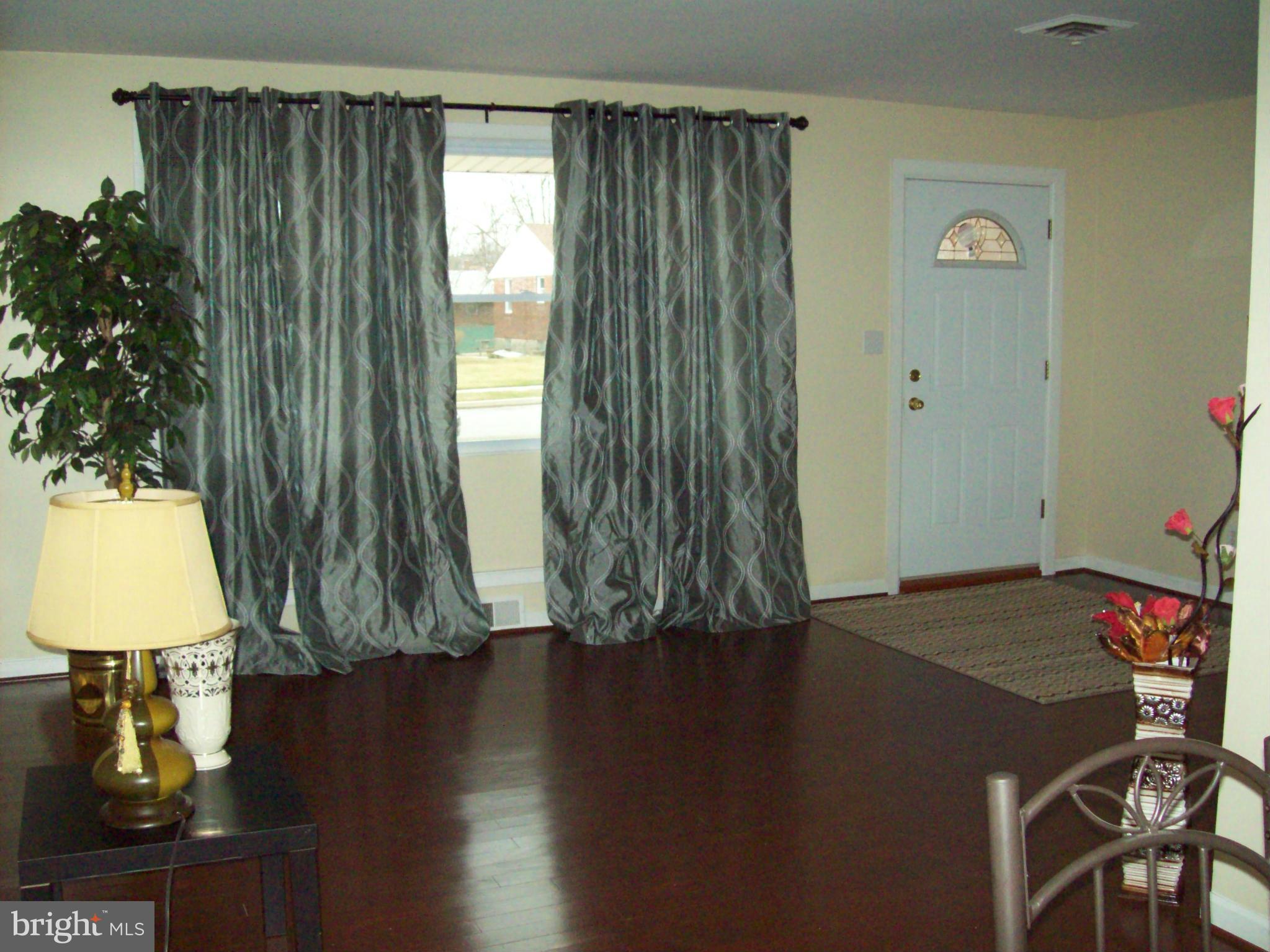 3516 Mayfair Road Baltimore, MD 21207 - Photo 2 of 10 a view of a workspace with furniture and a window
