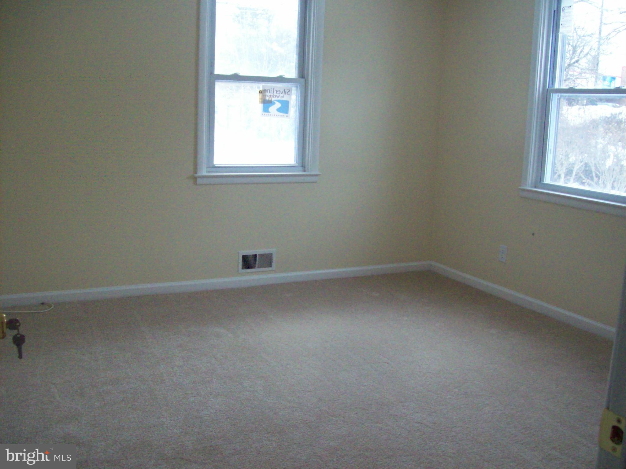 3516 Mayfair Road Baltimore, MD 21207 - Photo 8 of 10 an empty room with a window