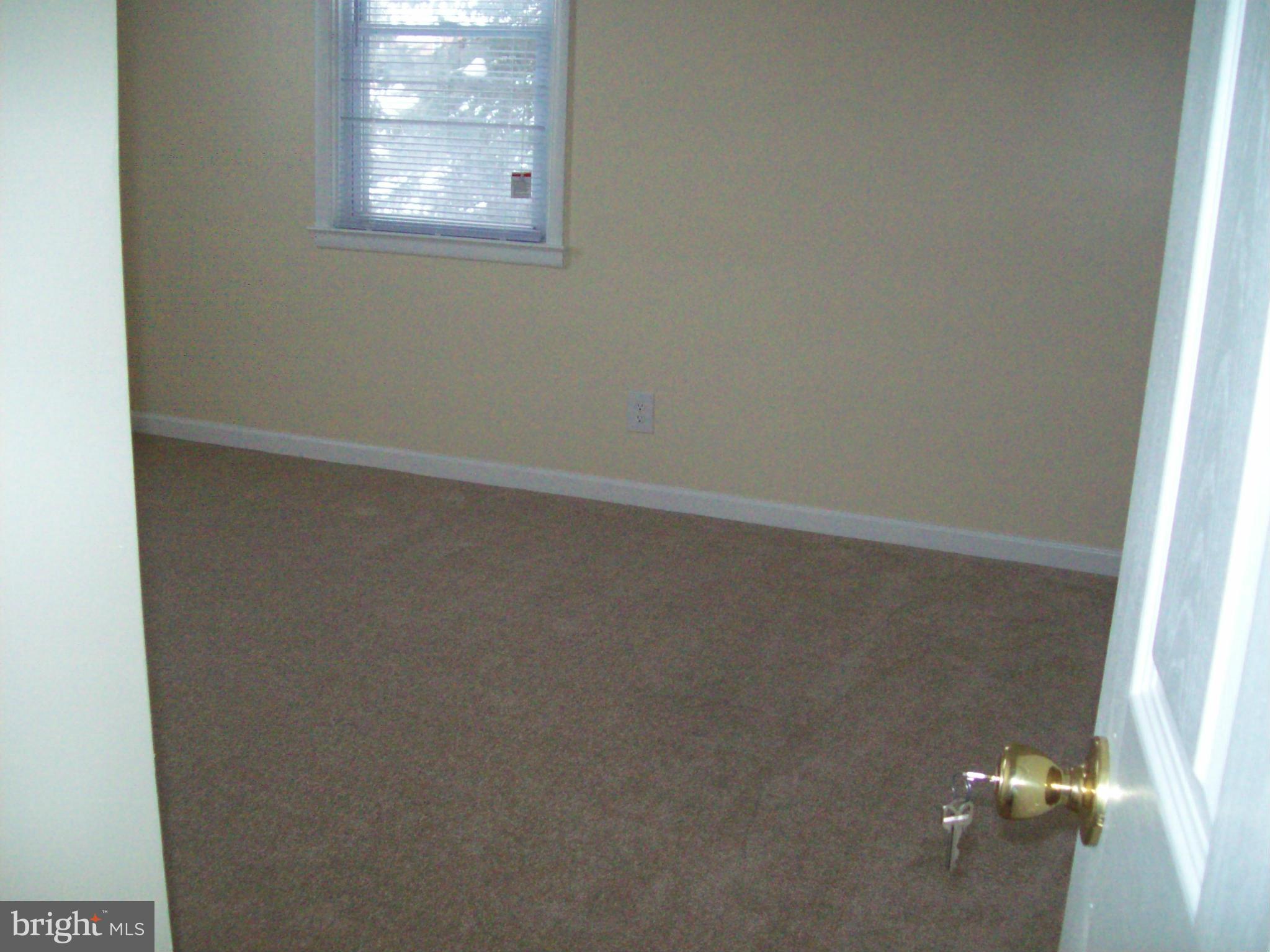 3516 Mayfair Road Baltimore, MD 21207 - Photo 10 of 10 an empty room with a window