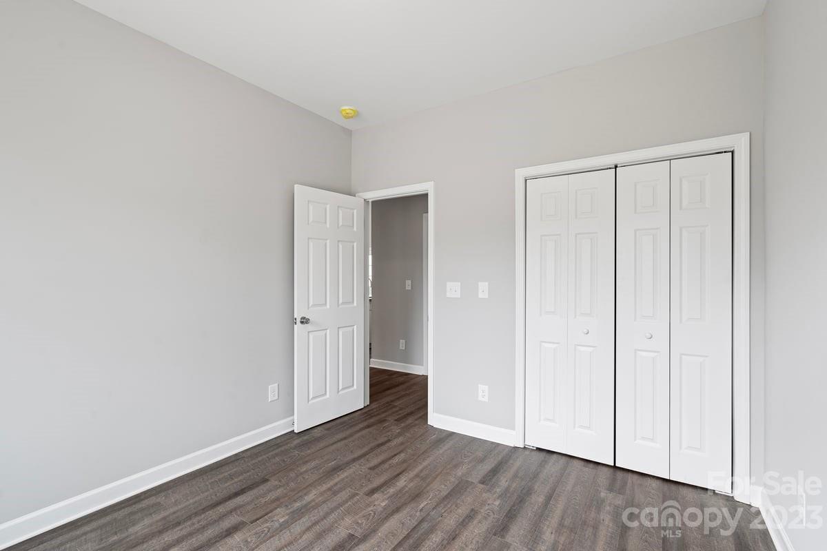 424 Queens Road Gastonia, NC 28052 - Photo 14 of 18 a view of an empty room and wooden floor