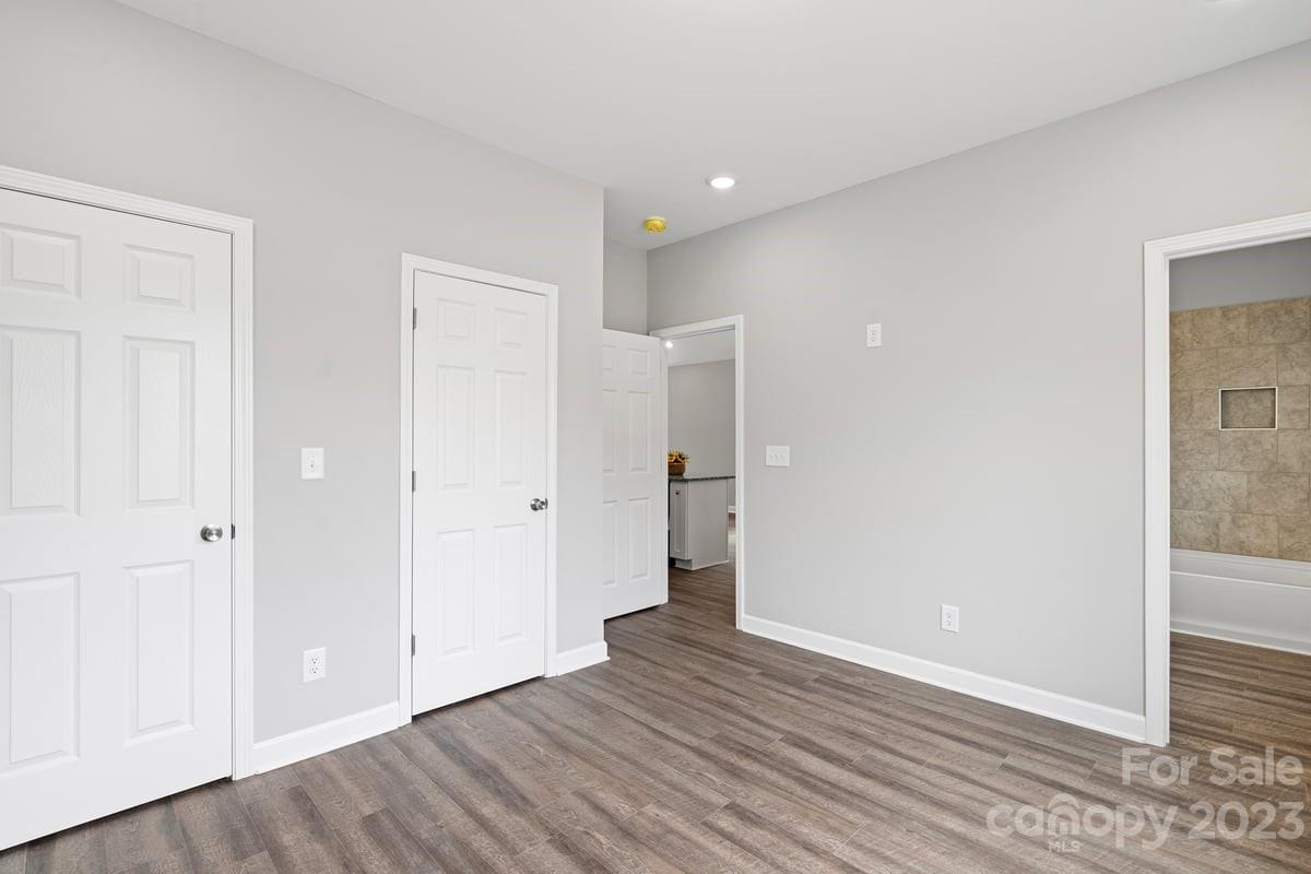 424 Queens Road Gastonia, NC 28052 - Photo 16 of 18 a view of an empty room with wooden floor
