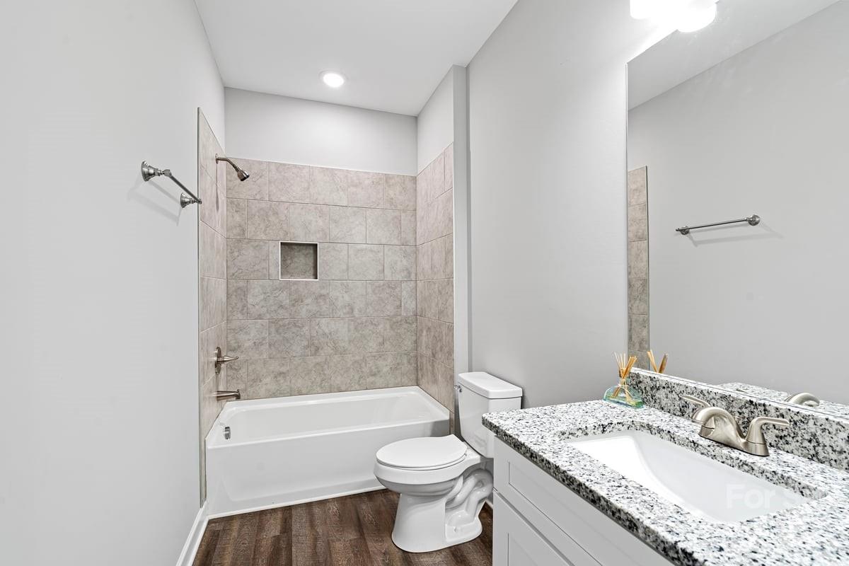 424 Queens Road Gastonia, NC 28052 - Photo 10 of 18 a bathroom with a granite countertop sink toilet and shower