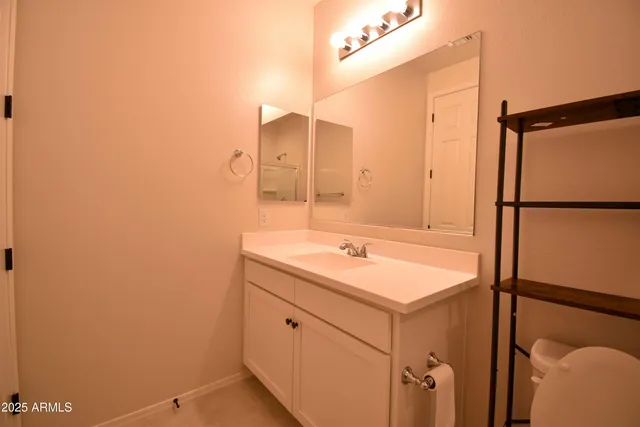 a bathroom with a sink and mirror