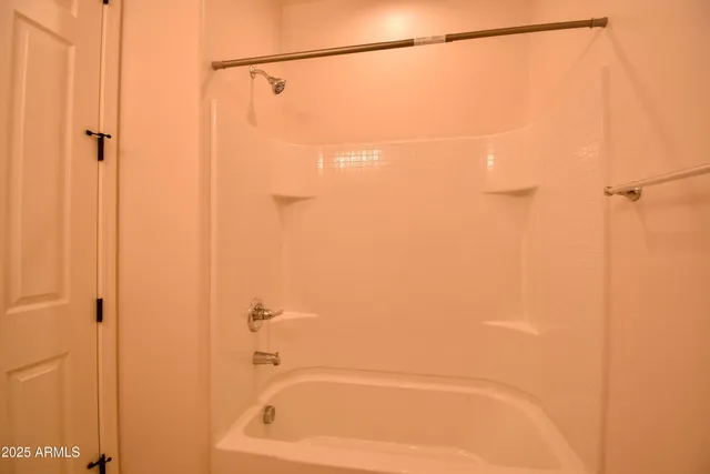 a bathroom with a shower and a shower