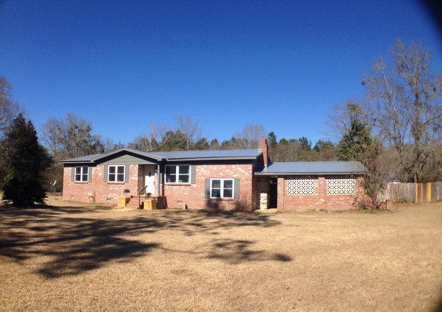 1113 Shady Grove Church Road Baker, FL 32531 - Photo 1 of 23 a front view of a house with a yard