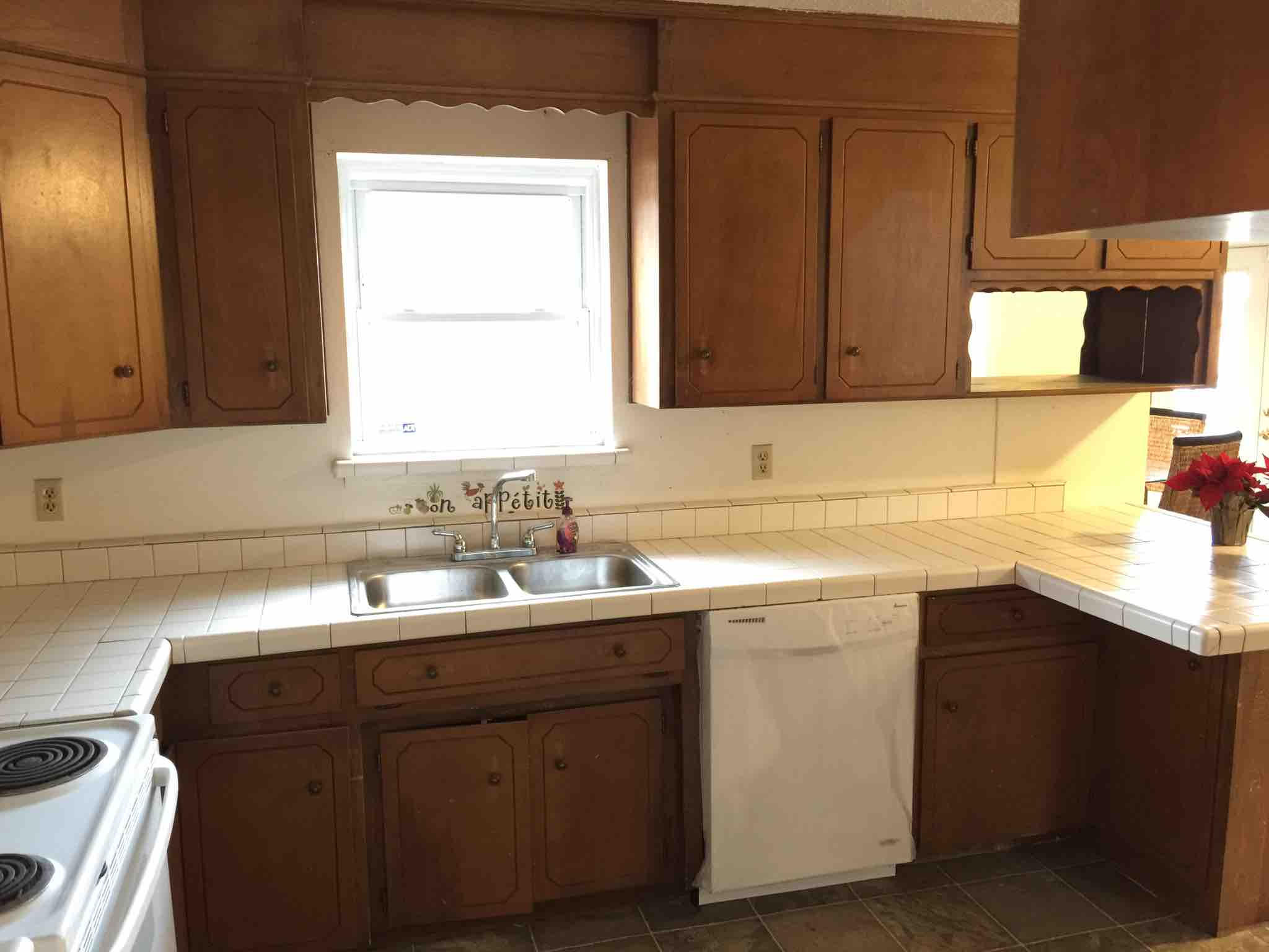 1113 Shady Grove Church Road Baker, FL 32531 - Photo 9 of 23 a kitchen with a sink cabinets and a window