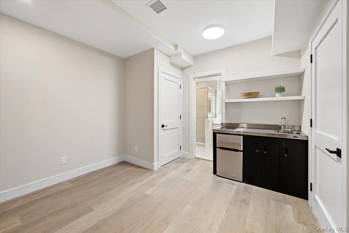395 5th Avenue New Rochelle, NY 10801 - Photo 19 of 26 a kitchen with granite countertop a refrigerator and a sink