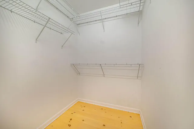 a bathroom with a sink toilet a mirror and bathtub