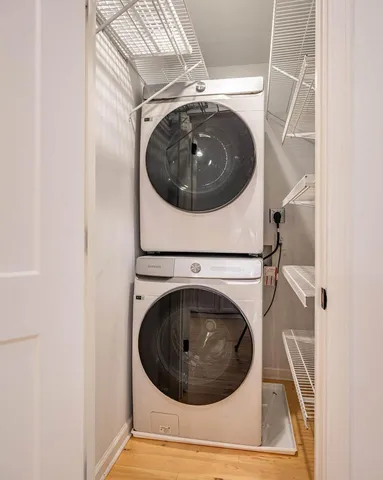 a view of staircase with white walls and railing