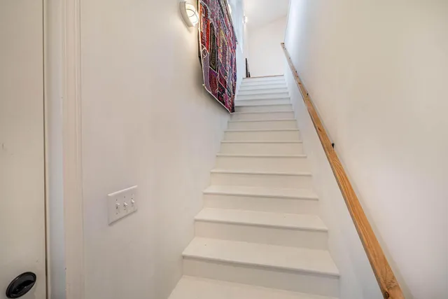 a view of house with yard and outdoor seating