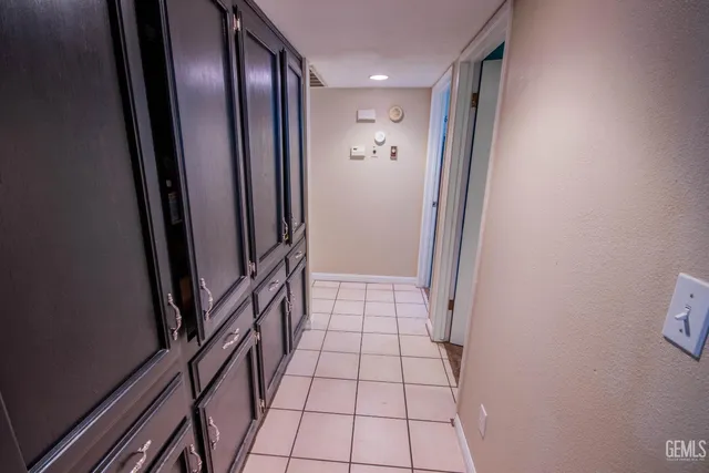 a bedroom with furniture and a flat screen tv
