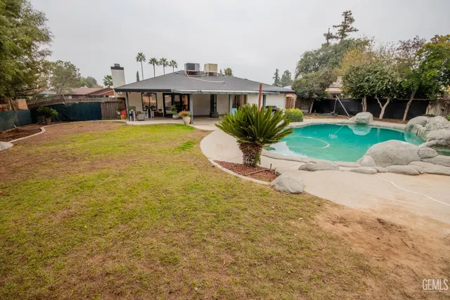 a view of a swimming pool with a outdoor seating area