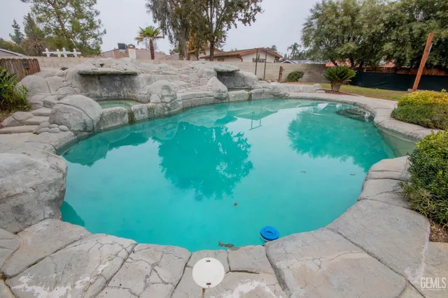 a view of a backyard with sitting area
