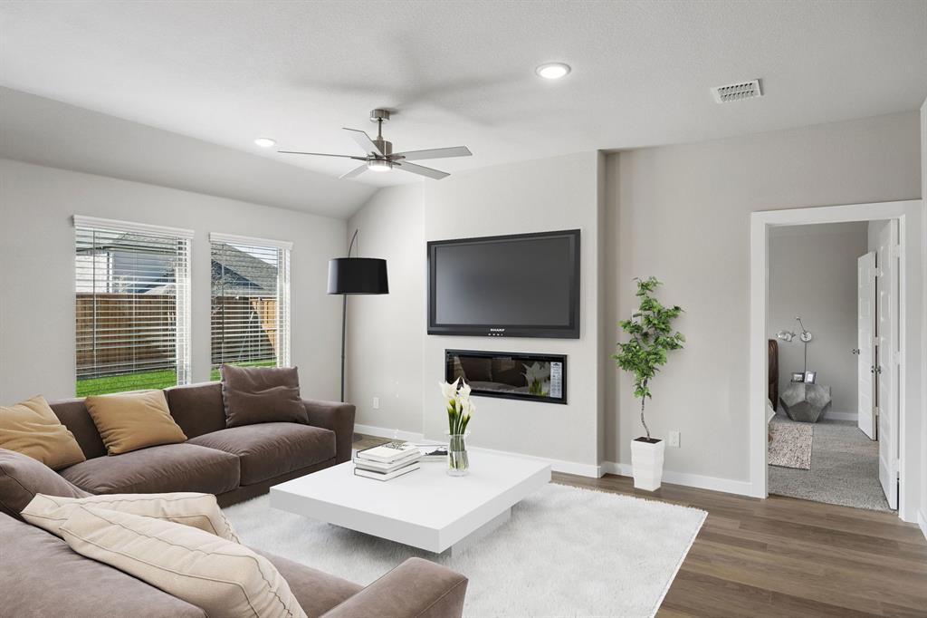 1441 Companero Street Haslet, TX 76052 - Photo 11 of 33 a living room with furniture a flat screen tv and a large window