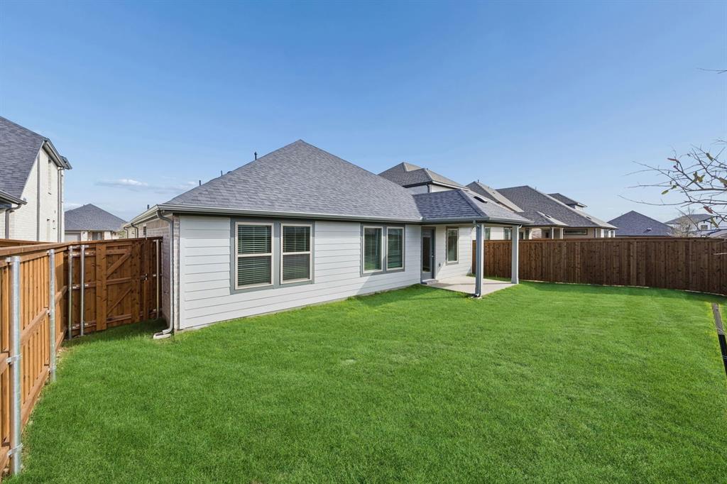 1441 Companero Street Haslet, TX 76052 - Photo 31 of 33 a front view of house with a garden