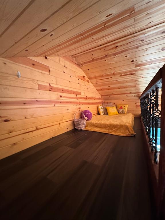429 County Road 1191 Kopperl, TX 76652 - Photo 14 of 30 Unfurnished bedroom with lofted ceiling, wooden walls, dark wood-style flooring, a sauna, and wood ceiling