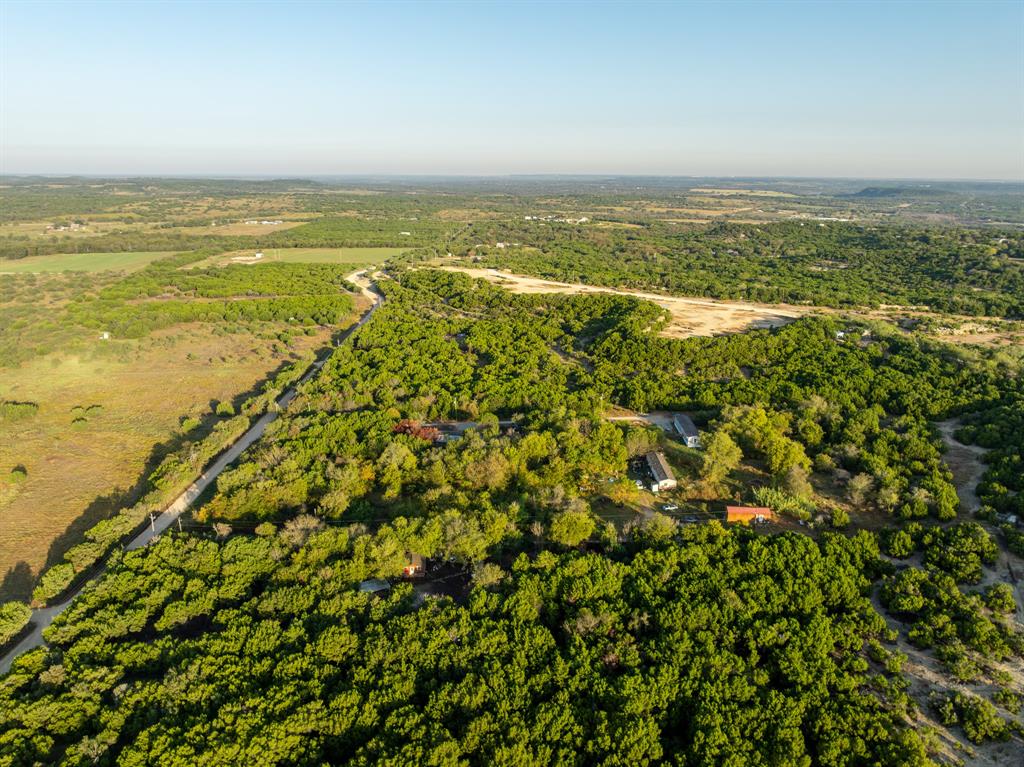 429 County Road 1191 Kopperl, TX 76652 - Photo 23 of 30 Aerial view of a heavily wooded area