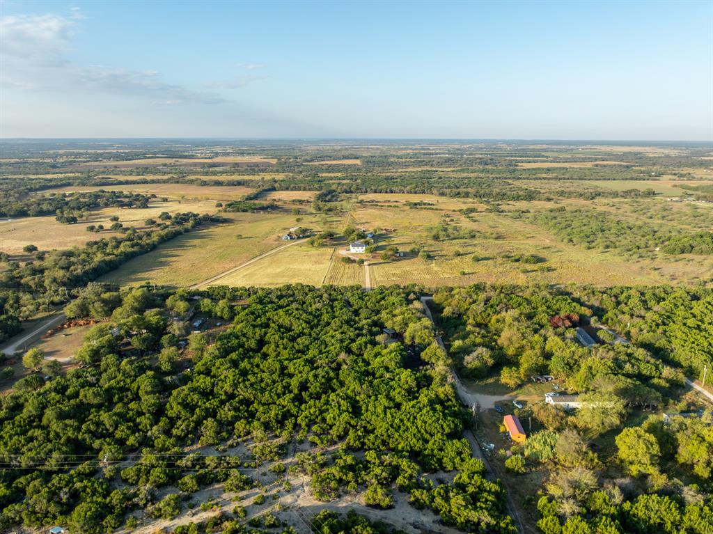 429 County Road 1191 Kopperl, TX 76652 - Photo 25 of 30 View of property location featuring a heavily wooded area and rural landscape