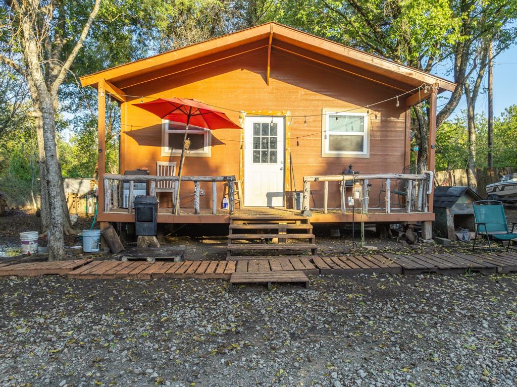 429 County Road 1191 Kopperl, TX 76652 - Photo 4 of 30 Rear view of property with a wooden deck