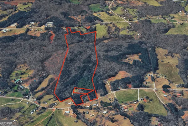 an aerial view of a houses with outdoor space