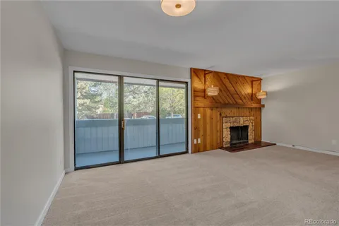 a front door view with a fireplace