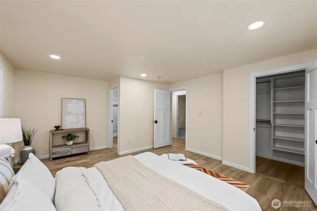 a bedroom with a bed and a dresser