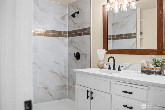 a bathroom with a sink and a mirror