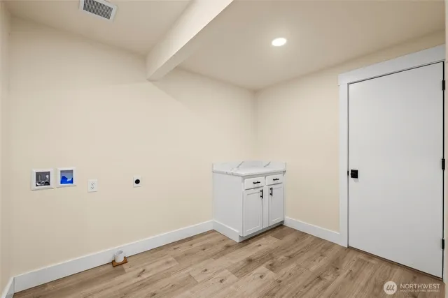 an empty room with wooden floor