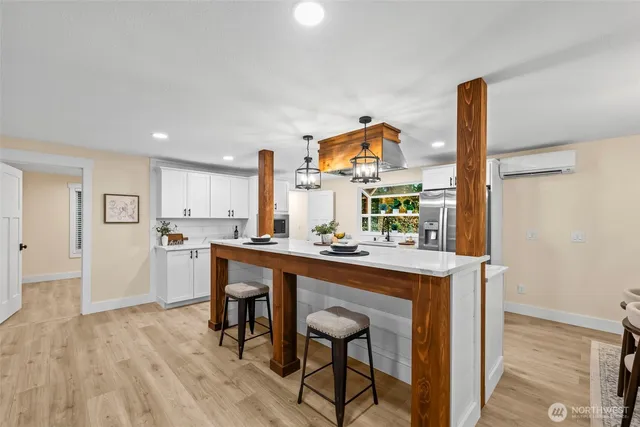a kitchen with stainless steel appliances granite countertop a sink and cabinets